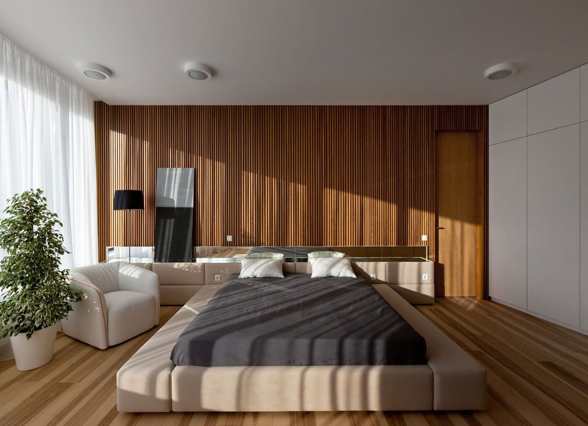 Красивая спальня с большим количеством естественного освещения и натуральных материалов в отделке